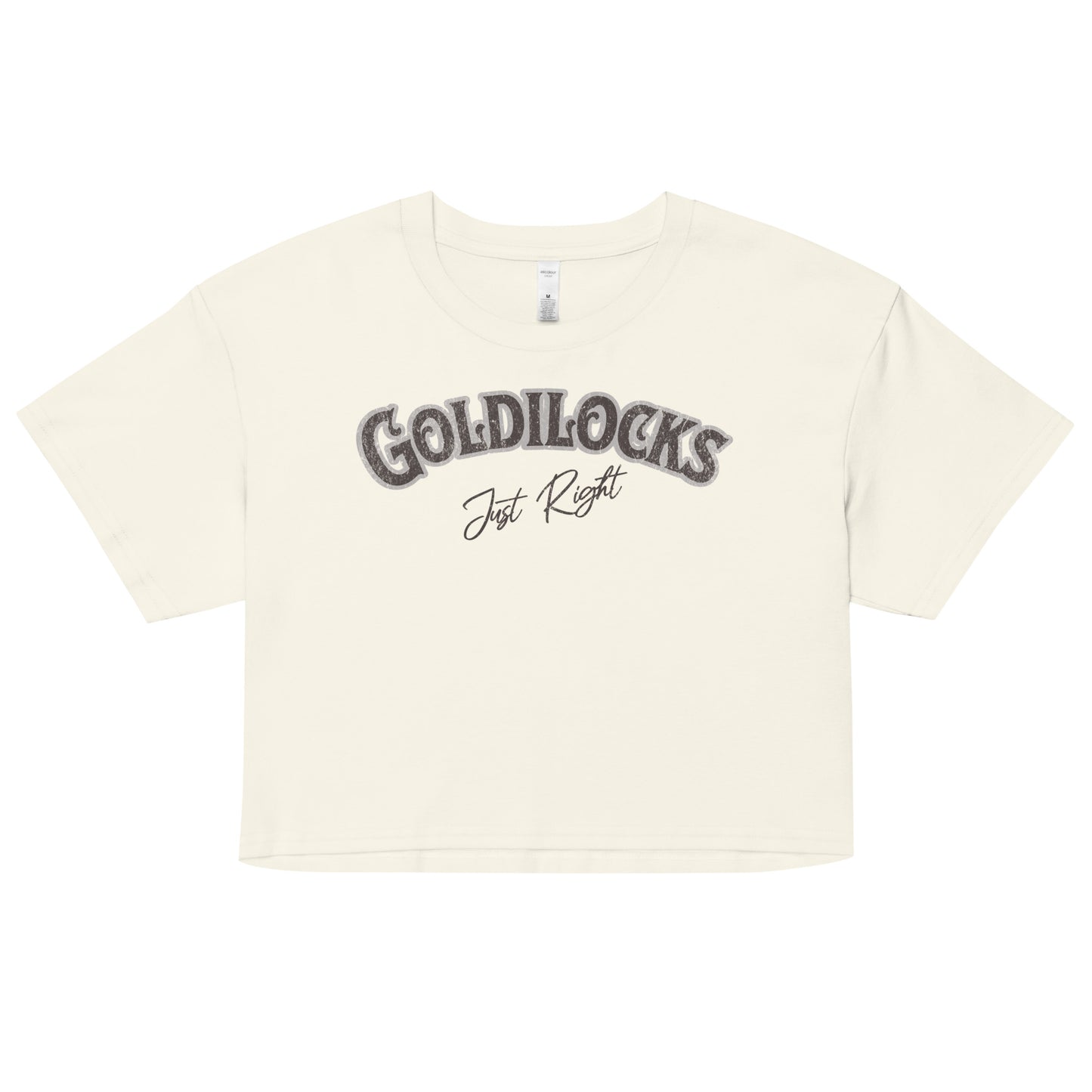 cream women’s crop top with the text “Goldilocks Just Right” in black and white Signmaster Pro textured font, designed in a bold retro style. Branded RedBlonde on the reverse