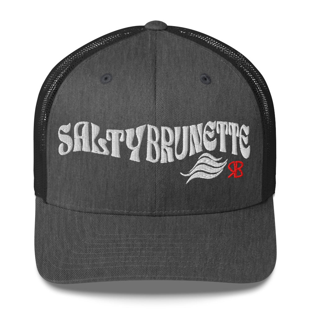 dark gray/black trucker cap with 'Salty Brunette' in white Solino display font. Branded RB in red