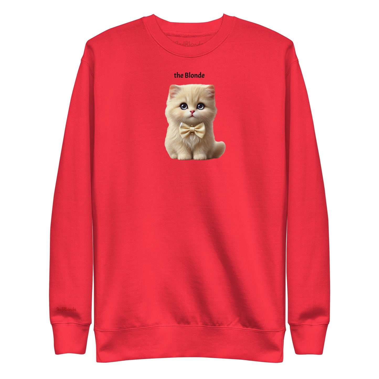 Flatlay of red relaxed fit unisex sweatshirt with a cute graphic of a blonde kitten wearing a bow-tie and the words 'the Blonde' linking to Blonde hair. Branded RedBlonde in red on inside neck and right cuff