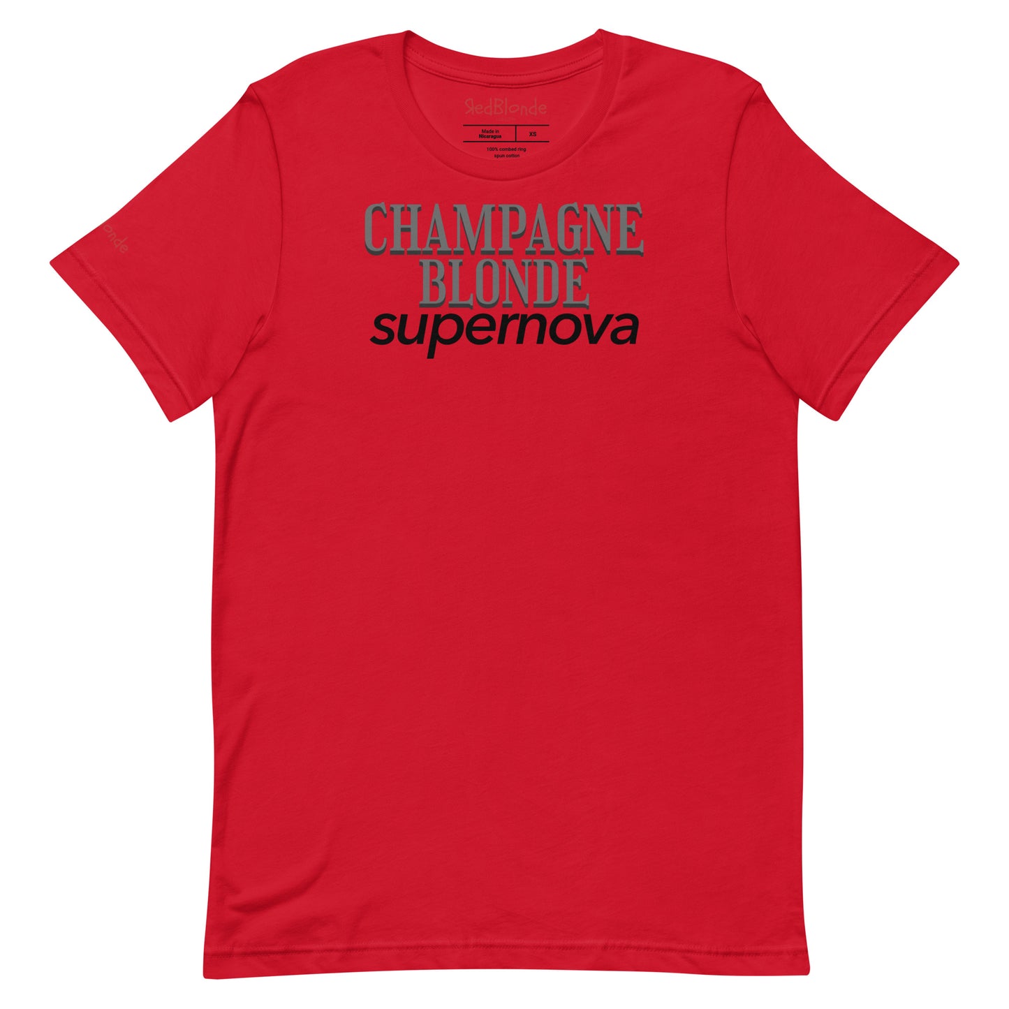 flatlay of red unisex t-shirt with the words 'CHAMPAGNE BLONDE' in grey Girasoll font with 'supernova' underneath in black. Branded RedBlonde in Red on inside neck and right sleeve