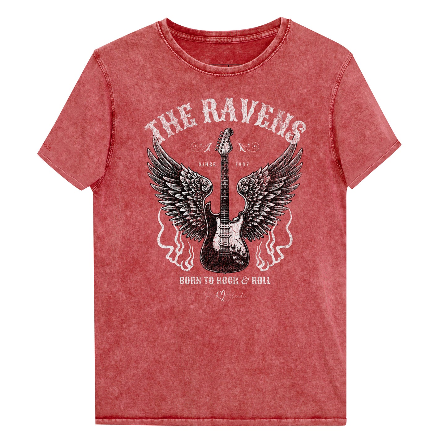 A flatlay of a garnet red denim wash unisex t-shirt with a graphic of a black & white guitar with raven bird wings emerging from the side. The graphic features ‘THE RAVENS’ in Sancreek font in a semicircle above the guitar, while ‘BORN TO ROCK & ROLL’ is underneath. Branded RedBlonde London in inside neck and right sleeve