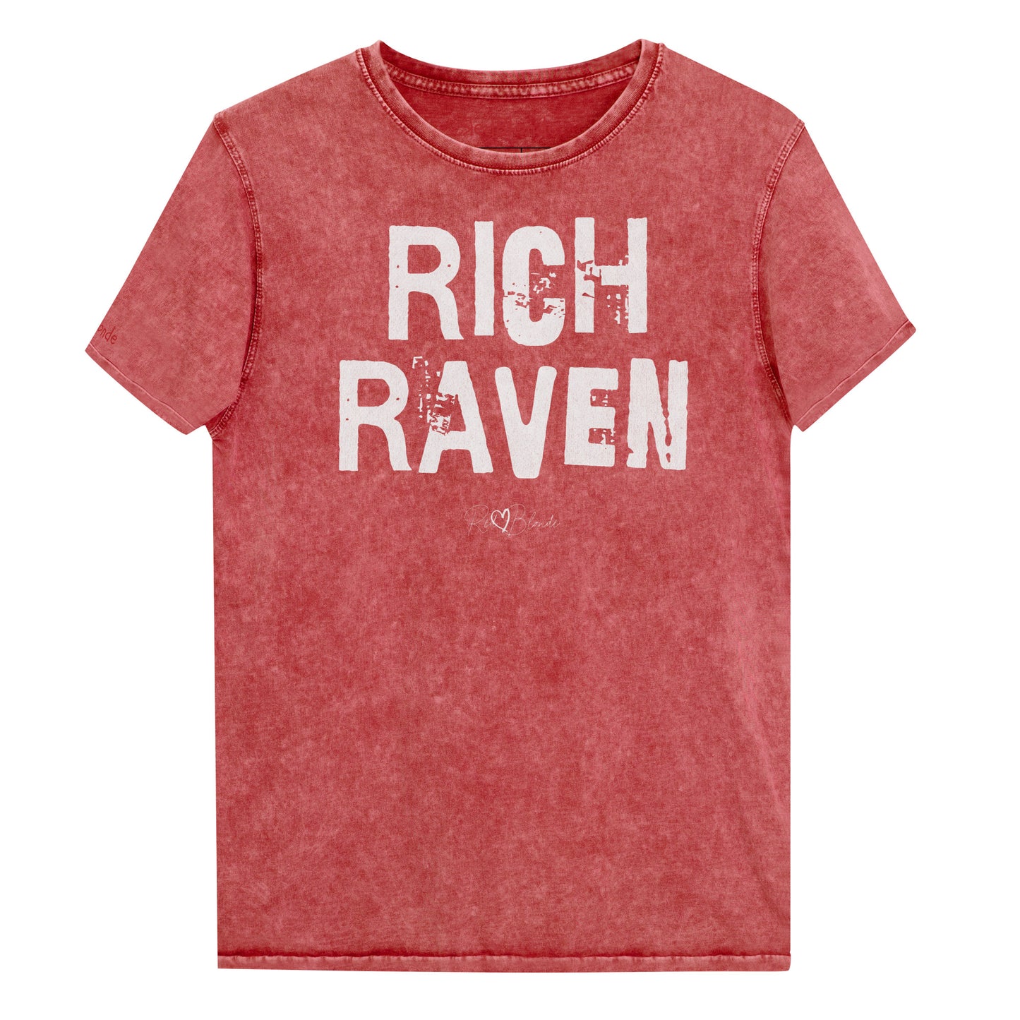 a garnet red acid-wash unisex denim T-shirt with a distressed vintage look. The shirt features the bold white text “RICH RAVEN” in a weathered Ed Gein font, and features the RedBlonde signature logo. The shirt has short sleeves, a crew neckline, and visible seam detailing for a rugged, casual style. Branded Redblonde on inside neck and right sleeve