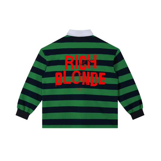 An image showing the back of a long-sleeved rugby polo shirt featuring a pattern of alternating horizontal green and navy stripes. The center of the back displays the words "RICH BLONDE" in large, distressed Ed Gein red block lettering, with a smaller signature-style logo printed directly underneath. The shirt is finished with a solid white collar and matching white ribbed cuffs.