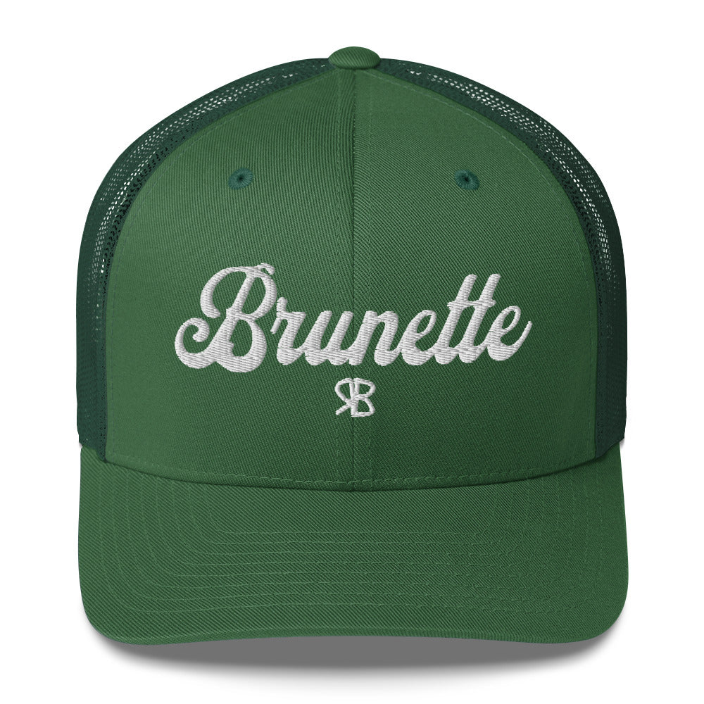green trucker cap with 'Brunette' in white adventurer 01 font on front. Branded RB