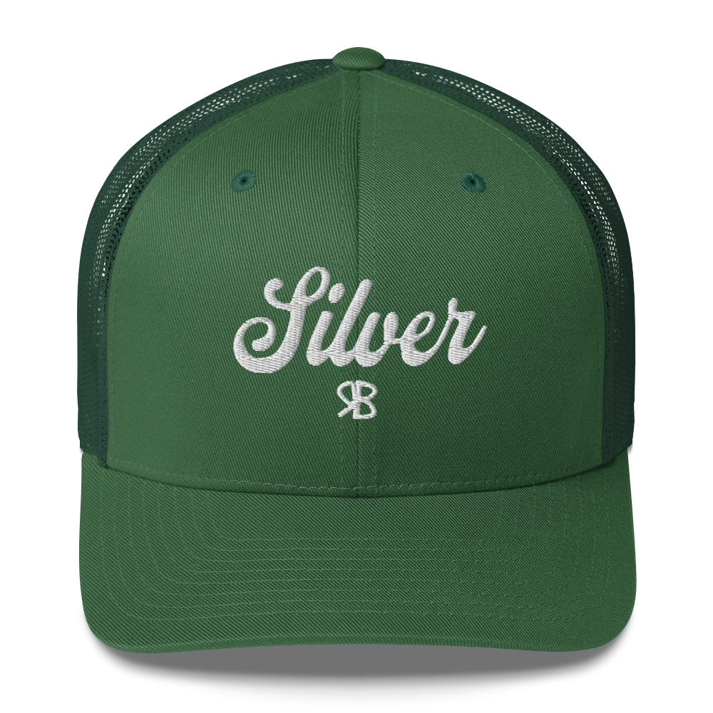 green trucker cap with 'Silver' in white adventurer 01 font on front. Mesh back. Branded RB