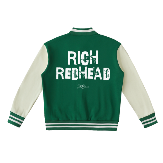 green & white varsity-style jacket with cream sleeves and striped ribbed trims. The back features large white text reading “RICH REDHEAD” in Ed Gein font with a small RedBlonde signature logo in the centre between the words