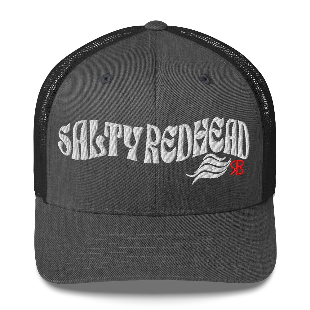 grey/black trucker cap with 'Salty Redhead' in white Solino display font. Branded RB in red