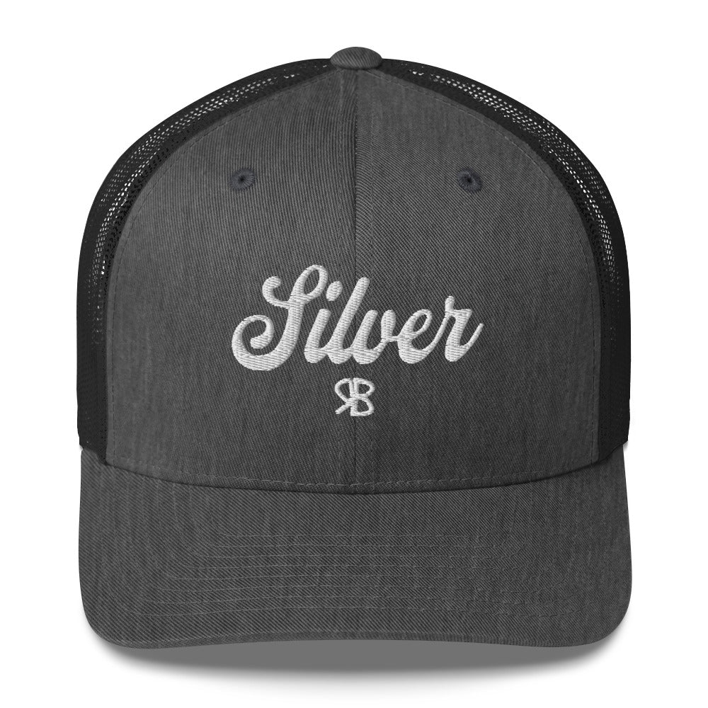 grey/black trucker cap with 'Silver' in white adventurer 01 font on front. Mesh back. Branded RB