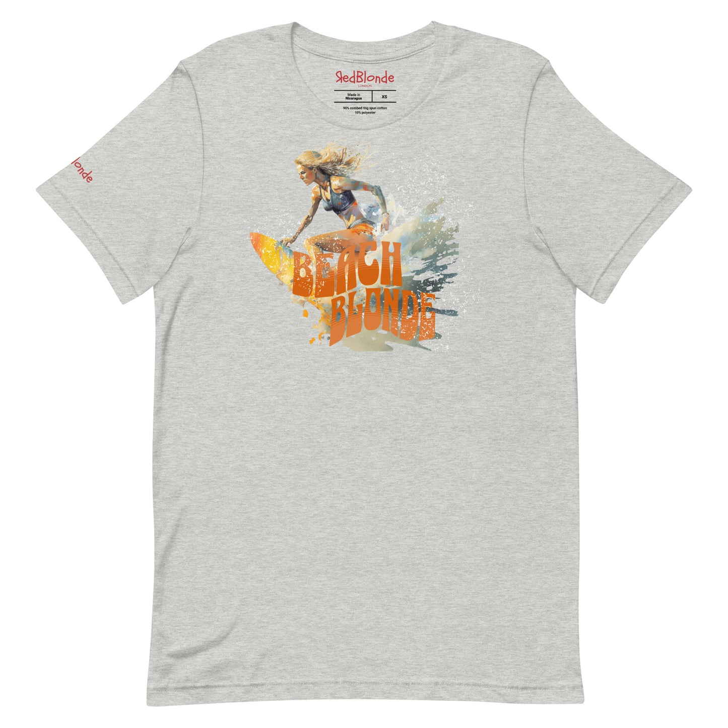 grey unisex relaxed fit t-shirt featuring a graphic of a blonde woman surfing with waves splashing around her and the words "BEACH BLONDE" in bold orange Solino Display font. Branded RedBlonde London on the inside neck and right sleeve