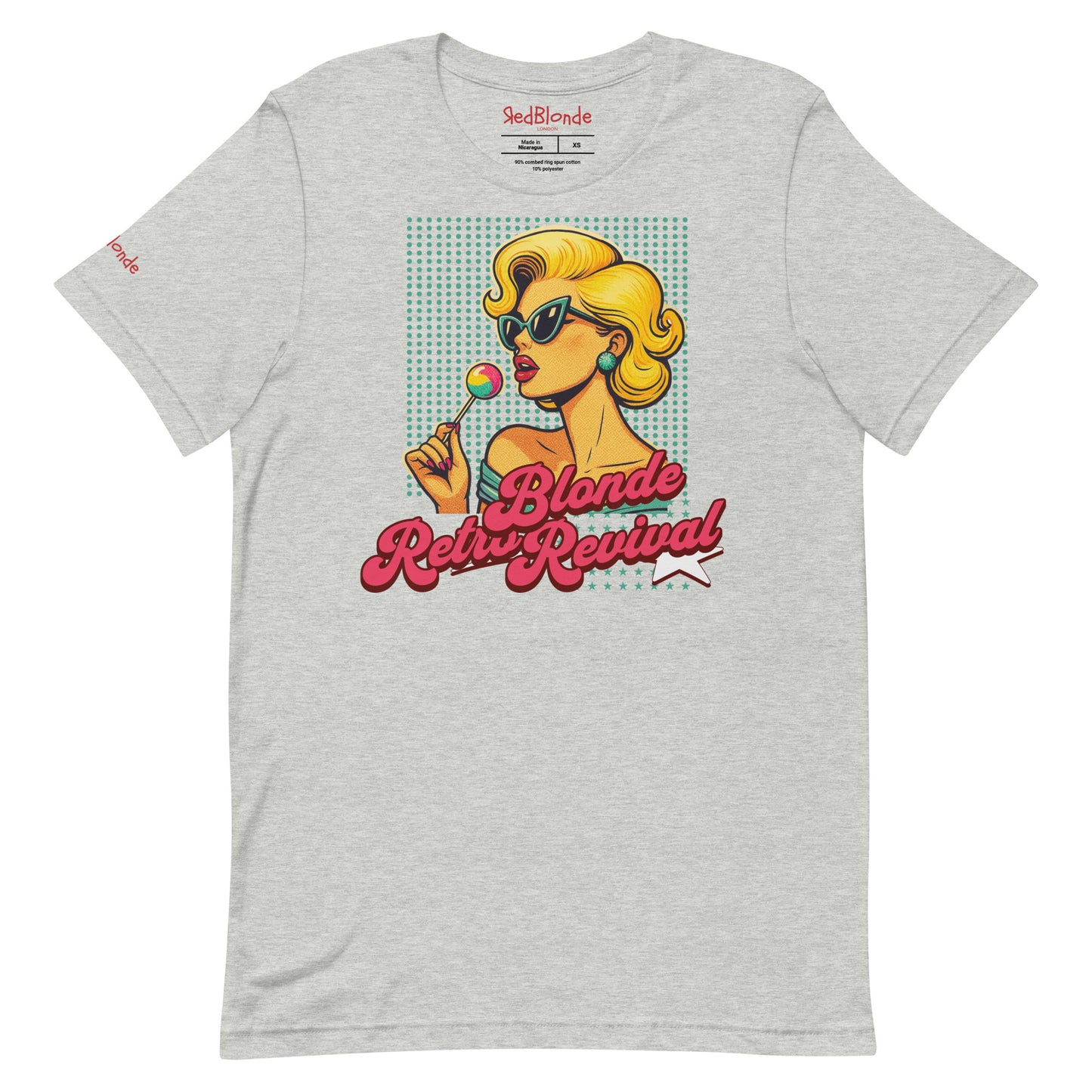 grey unisex t-shirt featuring a vibrant retro pop art illustration of a glamorous blonde woman in sunglasses holding a lollipop, with bold red script text that reads "Blonde Retro Revival." Branded RedBlonde on inside neck and right sleeve
