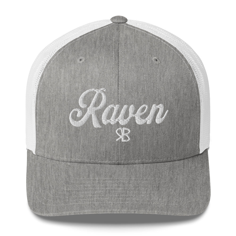 grey/white trucker cap with 'Raven' in white adventurer 01 font on front. Branded RB