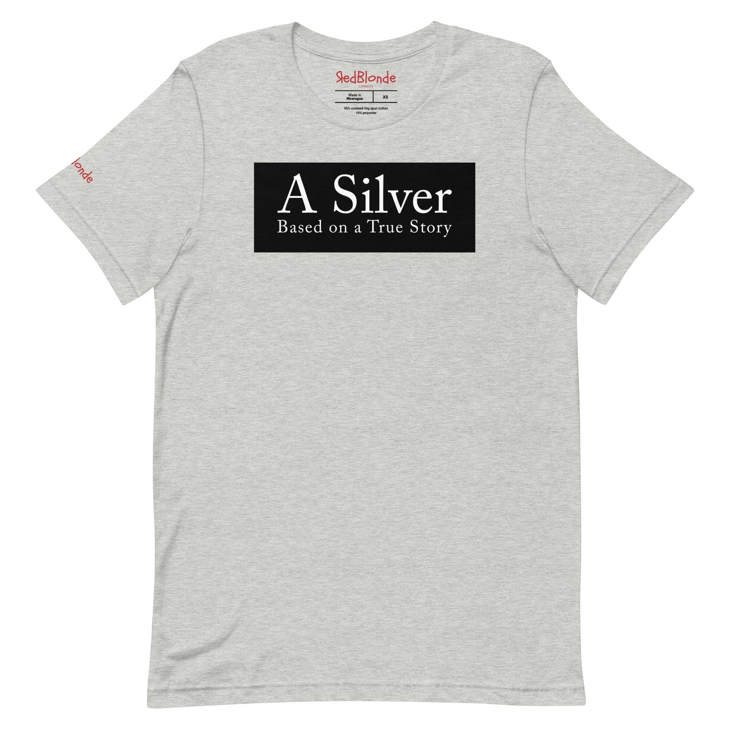 flatlay of a heather athletic grey unisex relaxed fit t-shirt with the slogan 'A Silver - Based on a True Story' in white text in a black box graphic. Branded RedBlonde London in red on inside neck and right sleeve