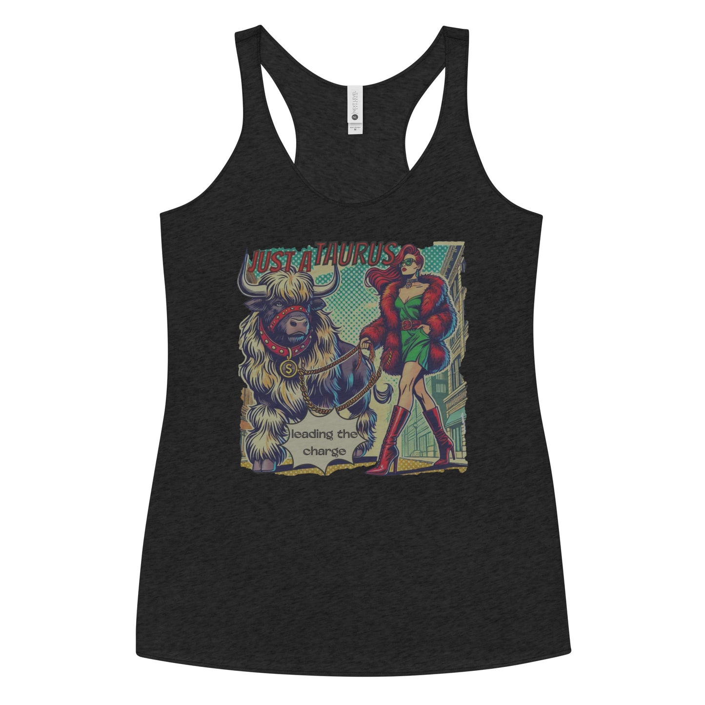 Flatlay of a heather black soft racerback tank t-shirt with a retro pop-art taurus graphic featuring a redhead woman with long flowing straight hair, wearing a green dress with a red belt, red high-heeled boots and red fur coat, walking a furry bull with a red collar and medallion in city street captioned ‘Just a taurus leading the charge'
