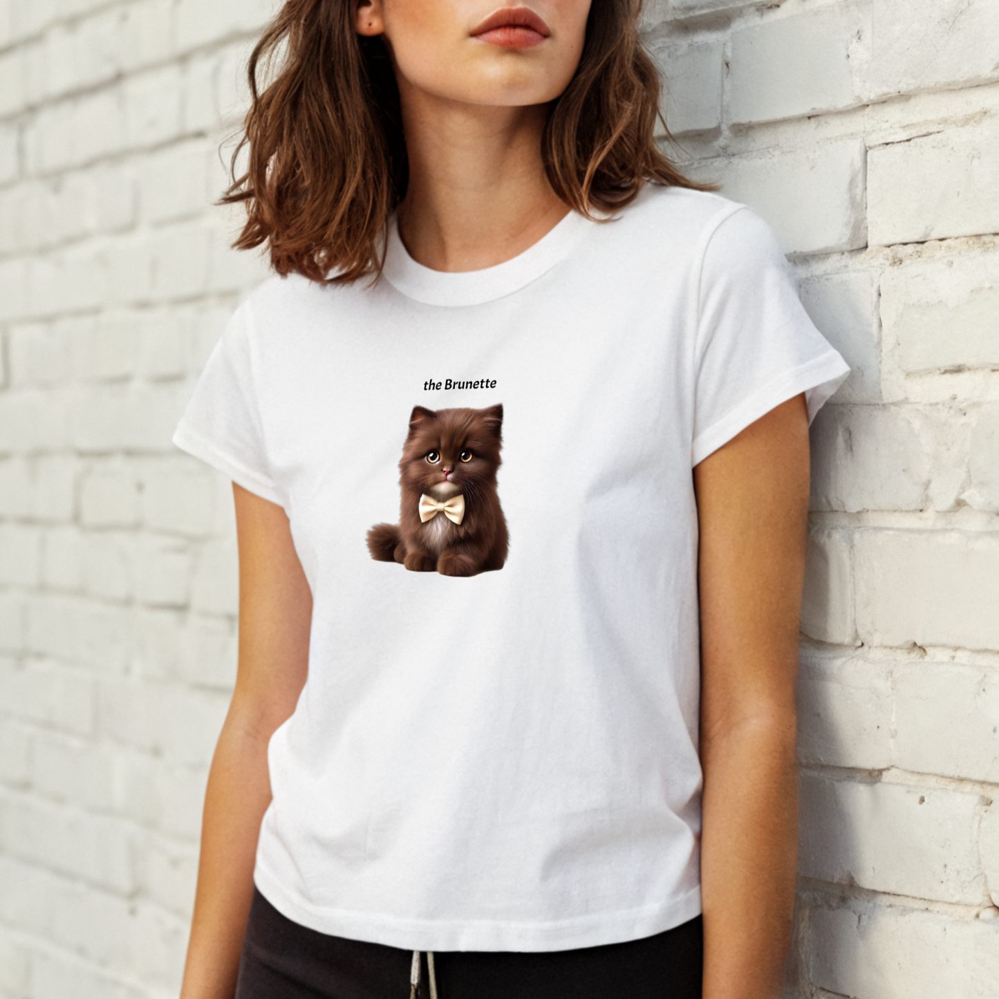 high waisted relaxed white t-shirt with cute graphic of brown/brunette kitten wearing a bow-tie and the words 'the Brunette' linking to brown/brunette hair