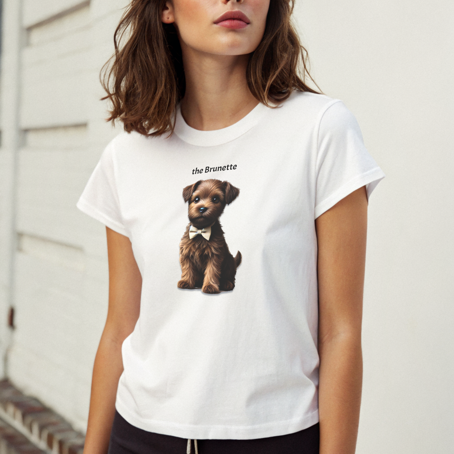 high waisted relaxed white t-shirt with cute graphic of brown/brunette puppy wearing a bow-tie and the words 'the Brunette' linking to brown/brunette hair