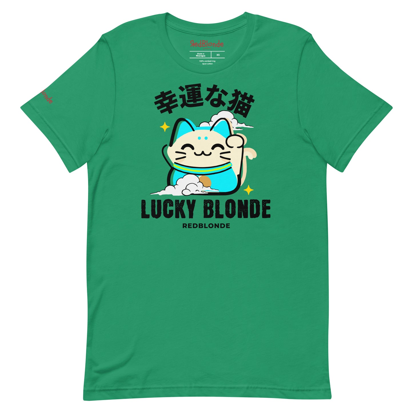 A kelly green unisex T-shirt featuring a cheerful maneki-neko (lucky cat) graphic in cream, turquoise, and black, with golden star accents. Above the cat are Japanese characters meaning “Lucky Cat.” Below the design, the text reads “LUCKY BLONDE” in bold black letters and “REDBLONDE” in smaller font. The T-shirt has a classic crew neckline and short sleeves. Branded RedBlonde on the inside neck and right sleeve