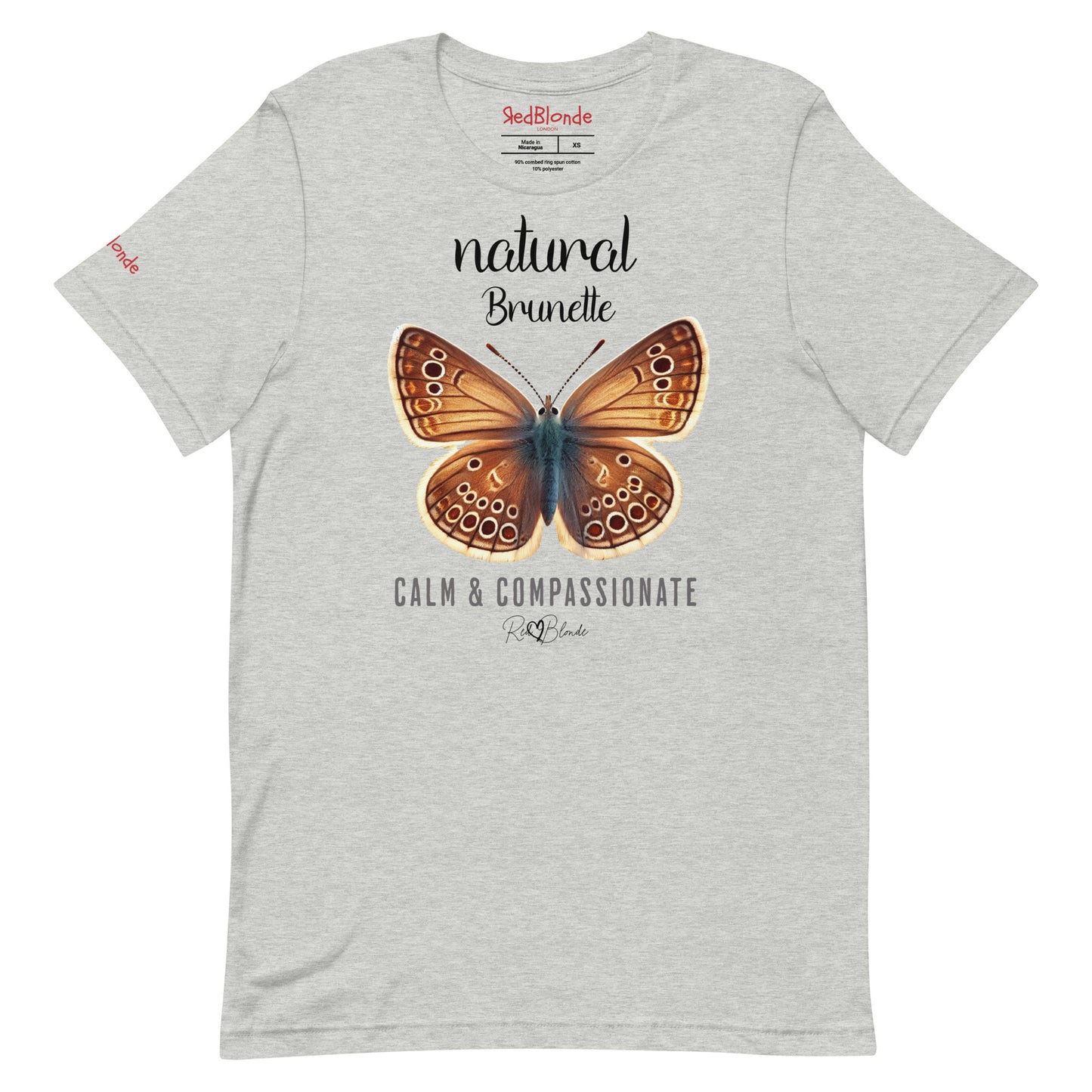 Flatlay of light grey unisex relaxed fit t-shirt with the words natural brunette in arionna font above a graphic of a brunette brown butterfly with 'CALM & COMPASSIONATE' below in adventurer 06 font signed off by RedBlonde. Branded RedBlonde London on inside neck and right sleeve