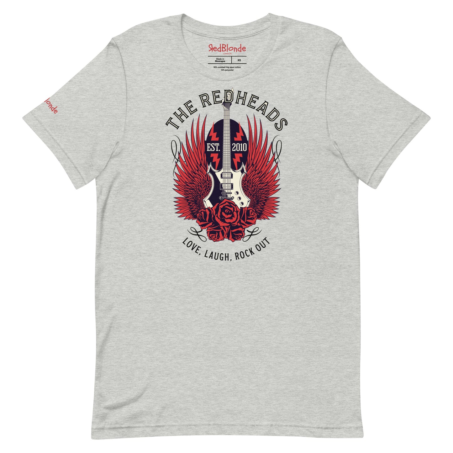 A flatlay of a light grey unisex t-shirt with a graphic of a black & white guitar with red bird wings emerging from the side. The graphic features ‘THE REDHEADS' in Brookfield font in a semicircle above the guitar, while ‘Love, laugh, rock out’ is underneath. Branded RedBlonde London in inside neck and right sleeve