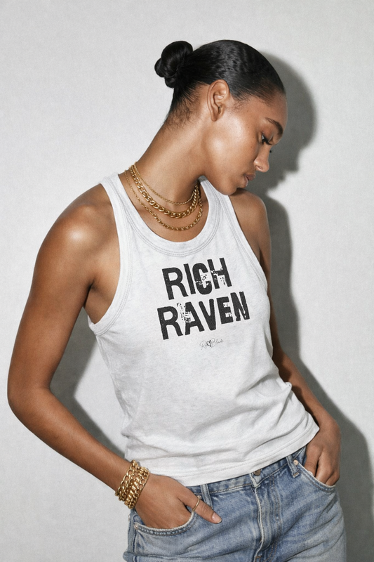 model wears a White acid-wash vintage tank top with bold black Ed Gein font “RICH RAVEN" slogan on the front and RedBlonde logo beneath.