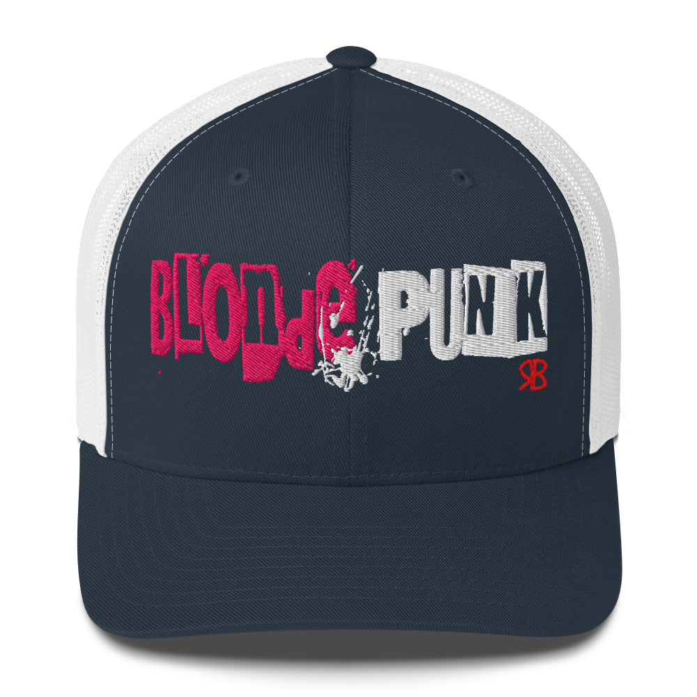 navy/white trucker cap with 'Blonde Punk' in irregular printing block style caps and lowercase. Blonde is written in bright pink and Punk in black lettering. Branded RB in red