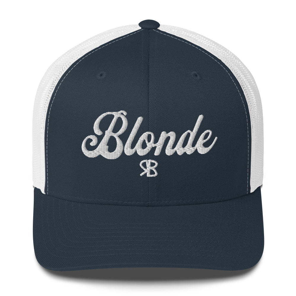 navy/white trucker cap with 'Blonde' in white adventurer 01 font on front. Mesh back. Branded RB