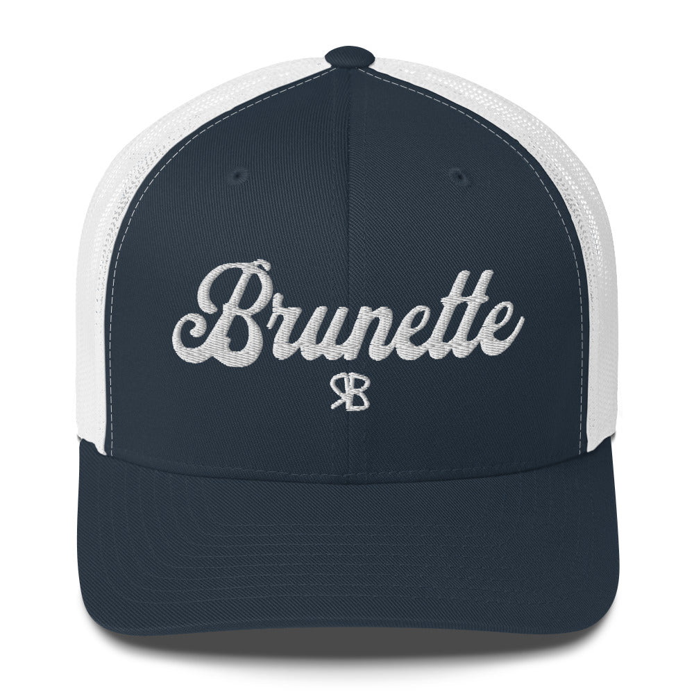 navy/white trucker cap with 'Brunette' in white adventurer 01 font on front. Branded RB
