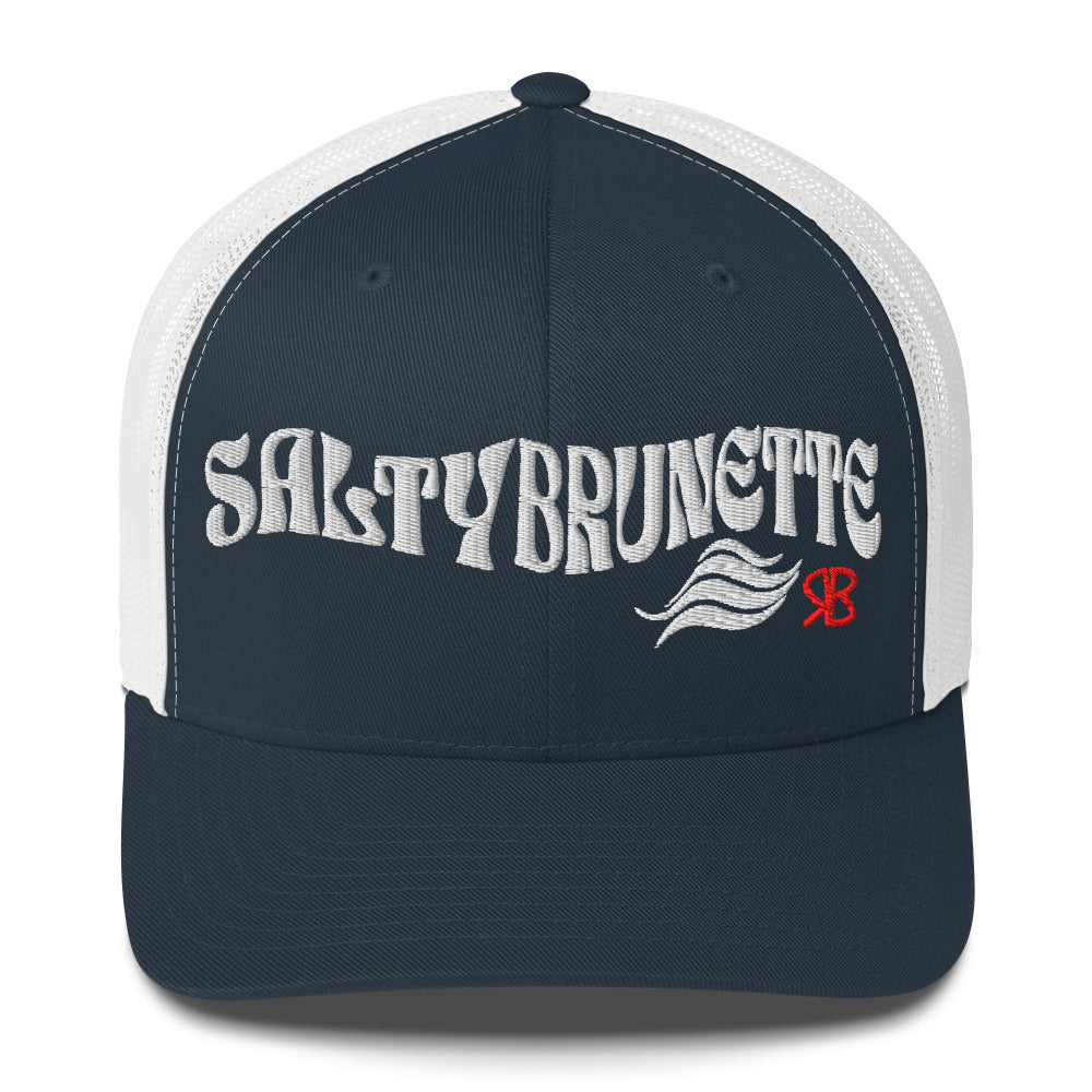 navy/white trucker cap with 'Salty Brunette' in white Solino display font. Branded RB in red