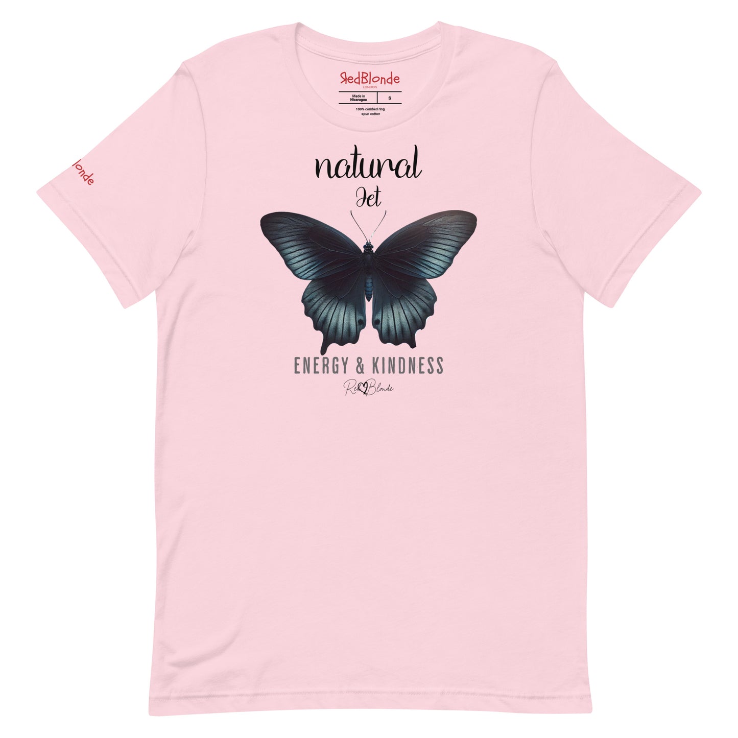 Flatlay of pale pink unisex relaxed fit t-shirt with the words natural Jet in arionna font above a graphic of a black butterfly with 'ENERGY & KINDNESS' below in adventurer 06 font signed off by RedBlonde. Branded RedBlonde London on inside neck and right sleeve