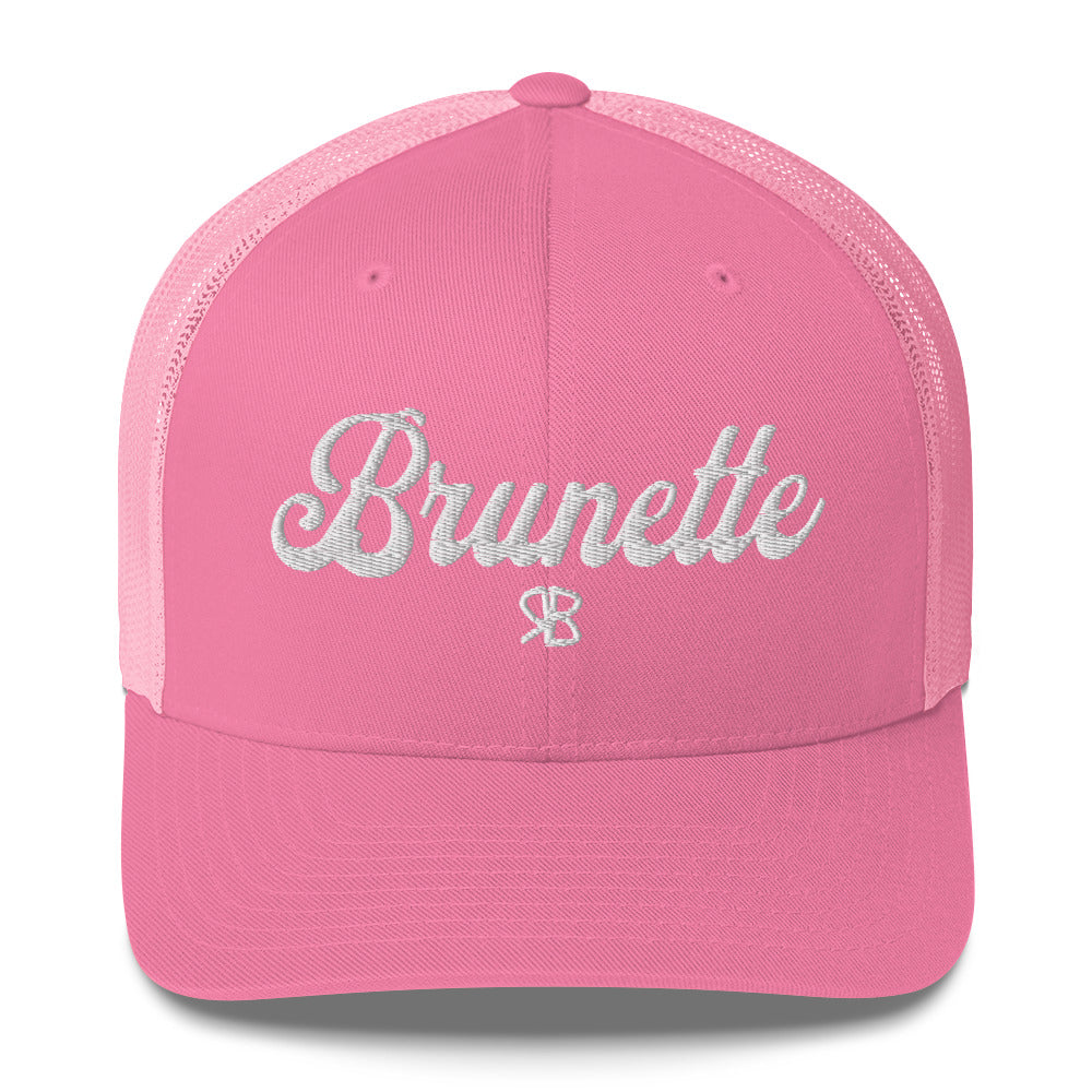 pink trucker cap with 'Brunette' in white adventurer 01 font on front. Branded RB