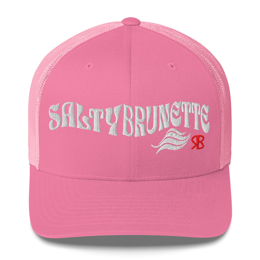 pink trucker cap with 'Salty Brunette' in white Solino display font. Branded RB in red