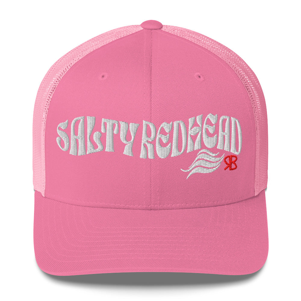 pink trucker cap with 'Salty Redhead' in white Solino display font. Branded RB in red