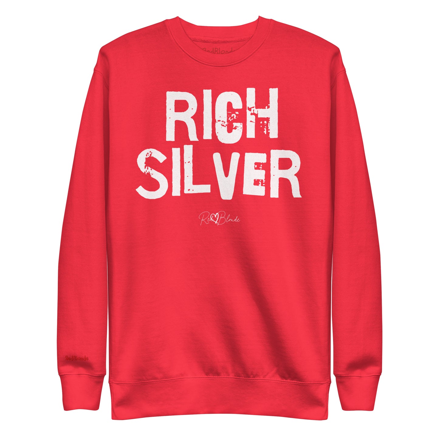 Red unisex premium sweatshirt with bold distressed white Ed Geinitext “RICH SILVER” on the front, featuring a subtle RedBlonde logo beneath the lettering and on the sleeve cuff and inside neck