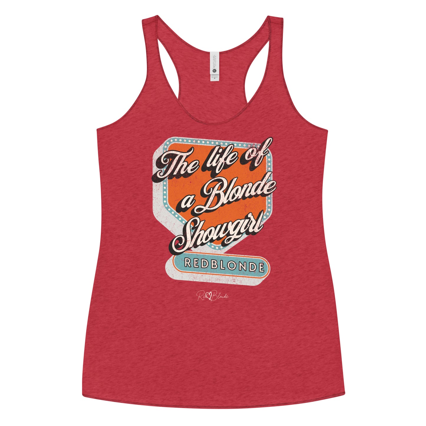 Vintage red racerback tank t-shirt with bold retro-style graphic text reading 'The life of a Blonde Showgirl' in white script over an orange and turquoise marquee design. The word 'RedBlonde' is displayed in turquoise block letters at the bottom, with subtle worn details giving the shirt a distressed, retro look."