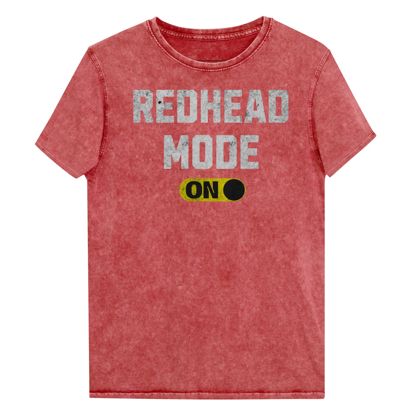 red denim-style unisex t-shirt with bold distressed white Univercity font reading “Redhead Mode” and a yellow on/off switch graphic in the “On” position beneath. The design includes subtle worn texture for a vintage look. Branded RedBlonde London in red on inside neck and right sleeve