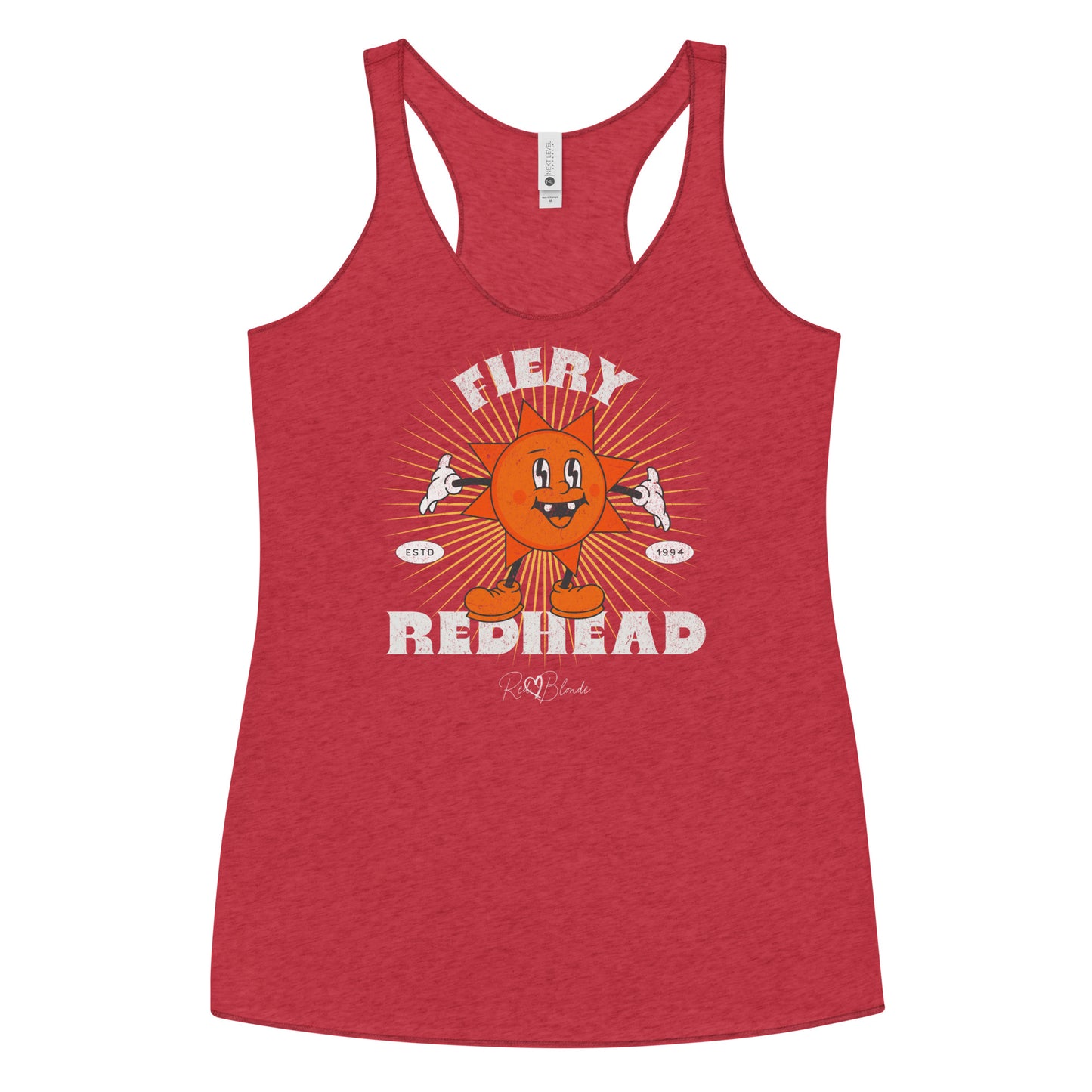 red women’s racerback tank with a bold retro graphic of a smiling orange cartoon sun character, surrounded by radiant sunbeams. The text reads ‘Fiery Redhead’ in distressed white Belzebuth lettering with small details including ‘ESTD 1994’ and the RedBlonde signature logo beneath."