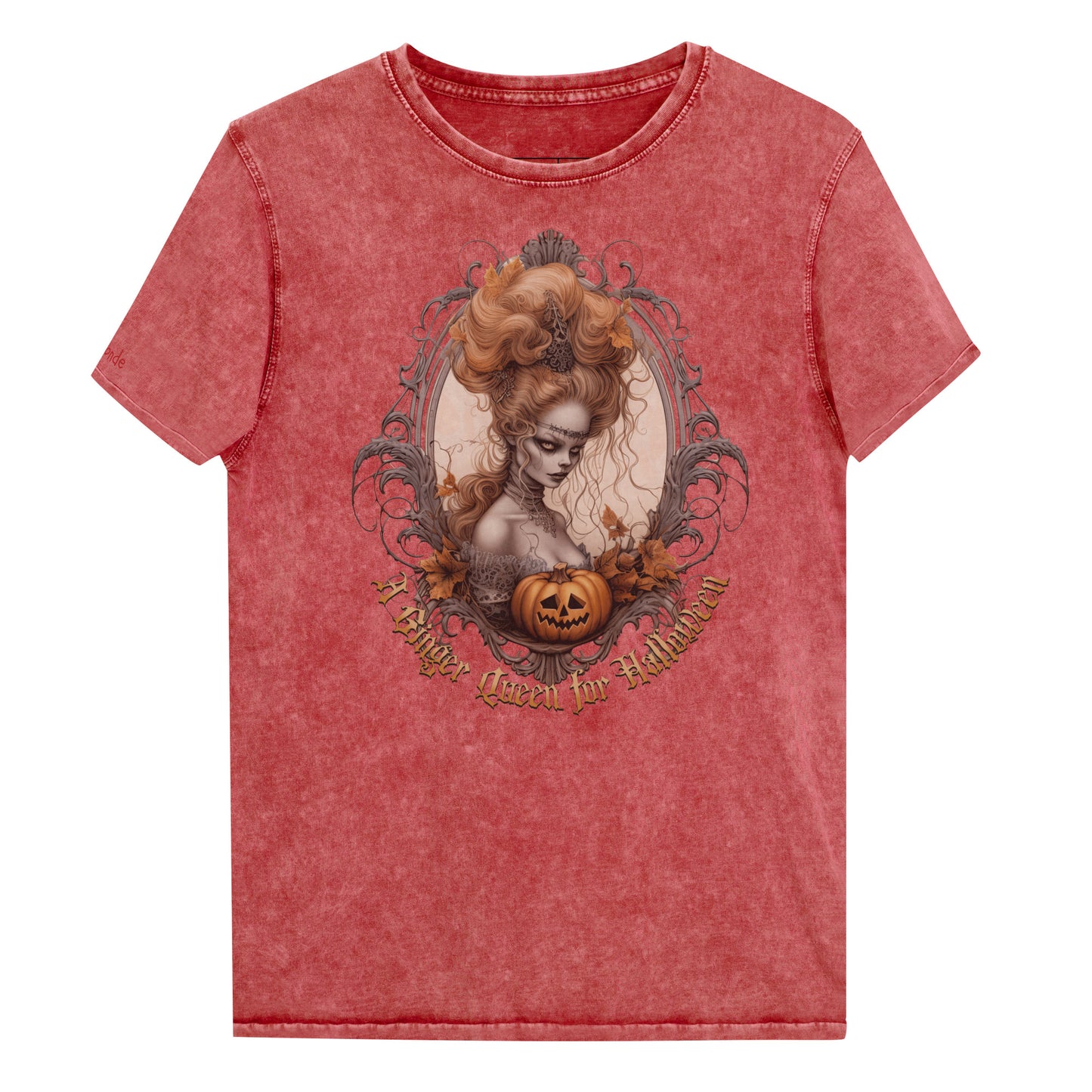 Red garnet acid-wash unisex T-shirt featuring a gothic-style illustration of ginger-haired woman with an elaborate beehive hairstyle, framed by ornate scrollwork, autumn leaves, and a carved pumpkin. The design is captioned with the text ‘A Blonde Queen for Halloween’ in vintage Dark Angle lettering. Branded RedBlonde in red on inside neck and right sleeve