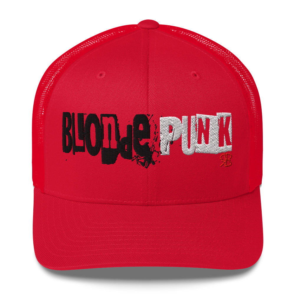red trucker cap with 'Blonde Punk' in irregular printing block style caps and lowercase. Blonde is written in black and Punk in white lettering. Branded RB in red