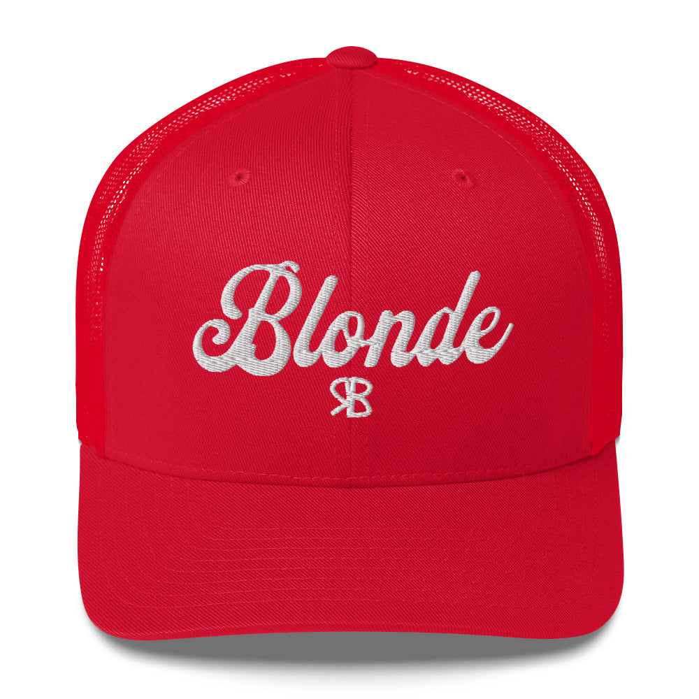 red trucker cap with 'Blonde' in white adventurer 01 font on front. Mesh back. Branded RB