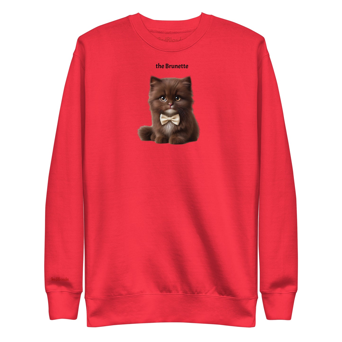 Flatlay of red relaxed fit unisex sweatshirt with a cute graphic of a brunette kitten wearing a bow-tie and the words 'the Brunette' linking to Brunette hair. Branded RedBlonde in red on inside neck and right cuff
