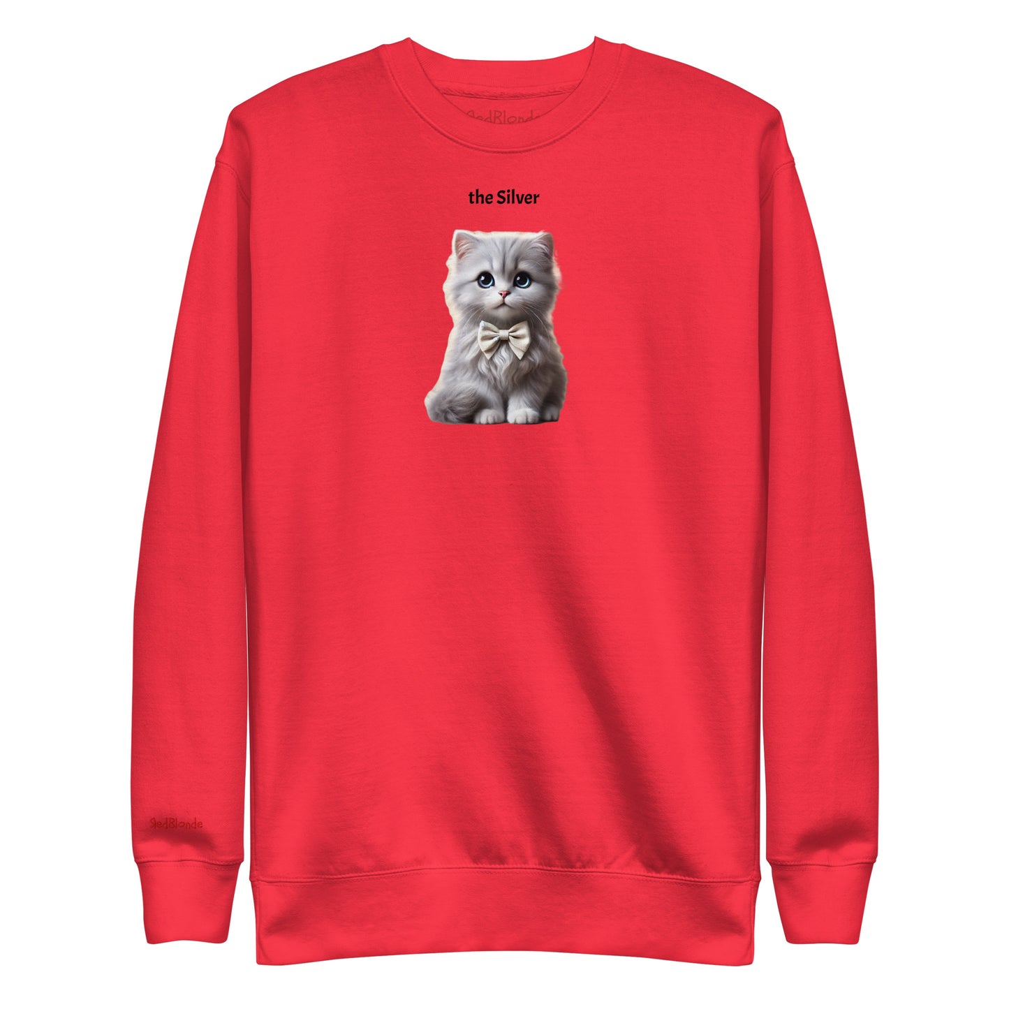 Flatlay of red relaxed fit unisex sweatshirt with a cute graphic of a silver kitten wearing a bow-tie and the words 'the Silver' linking to silver hair. Branded RedBlonde in red on inside neck and right cuff