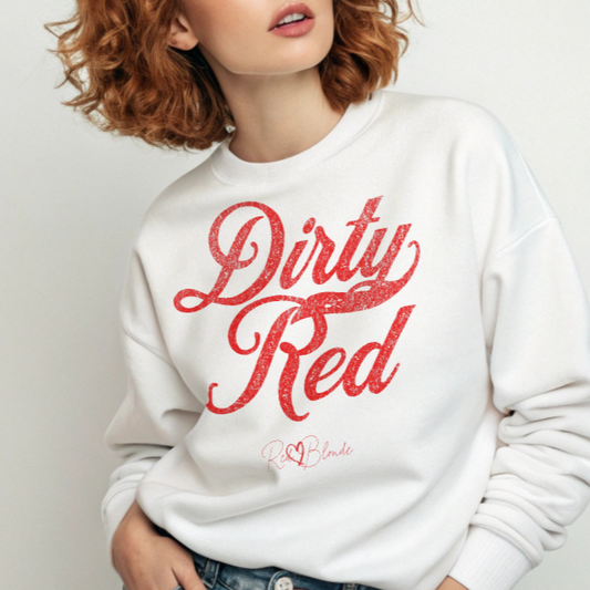 redhead wears a Classic relaxed fit premium unisex sweatshirt in white with the playful slogan ‘Dirty Red’ in red milk-store font, signed off RedBlonde. Branded RedBlonde London in red on inside neck and right cuff