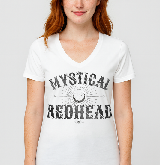 Redhead wears a white v-neck t-shirt with bold Sancreek vintage-style black lettering that reads ‘Mystical Redhead’ with a crescent moon and radiant sunburst graphic. Branded RedBlonde in red on inside neck and right sleeve