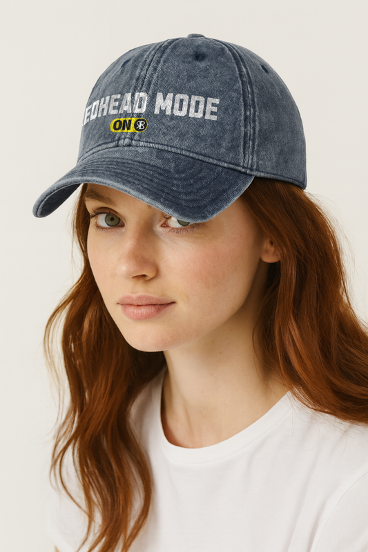 redhead wears blue denim cap with 'Redhead Mode ON' embroidered in white Univercity font with RB logo