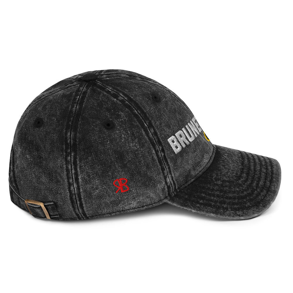 side view of black denim cap with 'Brunette Mode ON' embroidered in white Univercity font with RB logo