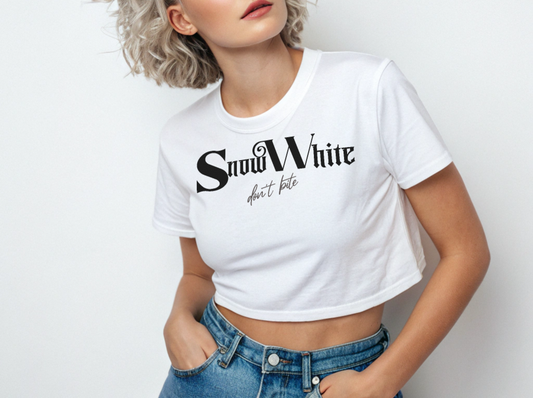 silver haired wears a White women’s crop top featuring black Angel Rhapsody gothic-inspired font that reads “Snow White” and the phrase “don’t bite” written underneath in a cursive script.