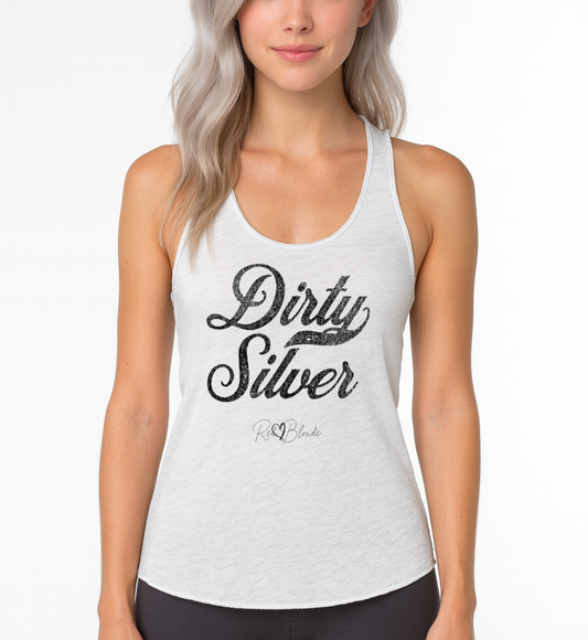 silver haired model wears white women's racerback tank with the playful slogan ‘Dirty Silver’ in black milk-store font, signed off RedBlonde. Branded RedBlonde London in red on the reverse
