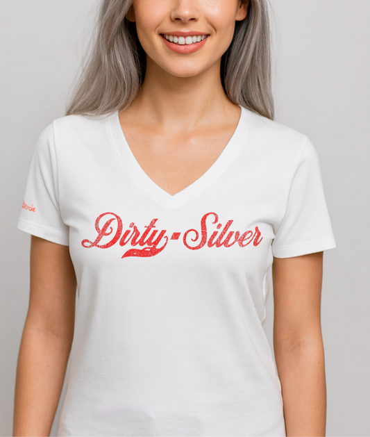 Silver model wears a white relaxed fit V-neck t-shirt with “Dirty Silver” written in vintage Coca-Cola red script on the front. branded redblonde on the inside neck and right shoulder in red
