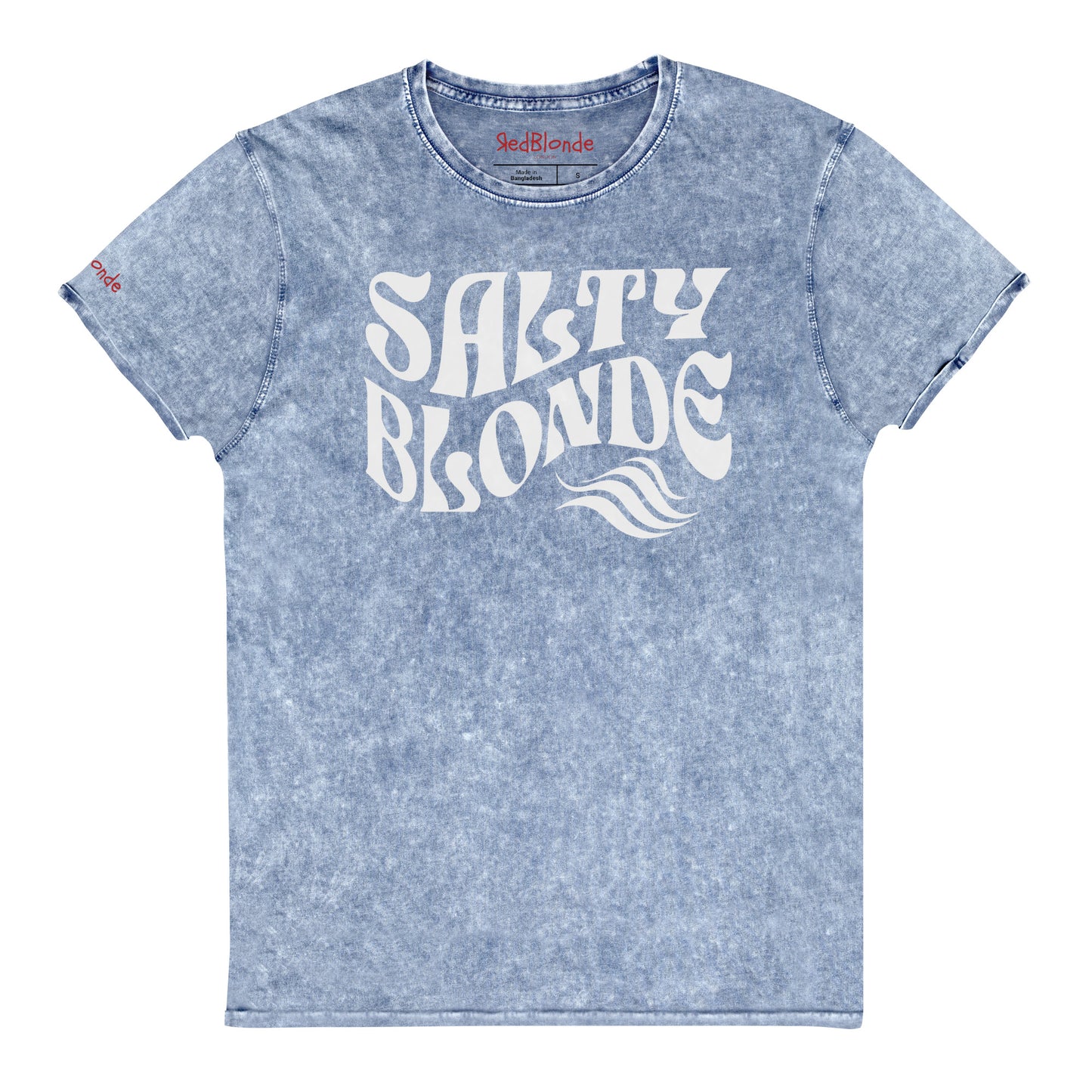 flatlay of soft blue denim vintage wash graphic t-shirt with the slogan 'Salty Blonde' in white retro 70s wavy font. Branded RedBlonde inside neck and right shoulder in red