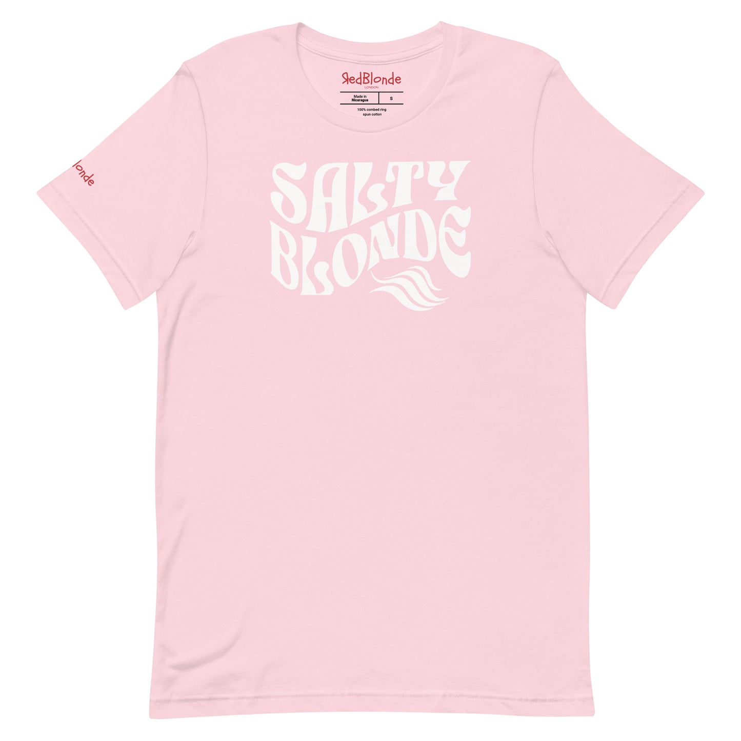 flatlay of soft pink classic unisex graphic t-shirt with the slogan 'Salty Blonde' in Solino Display white retro 70s wavy font. Branded RedBlonde in red on inside neck and right sleeve