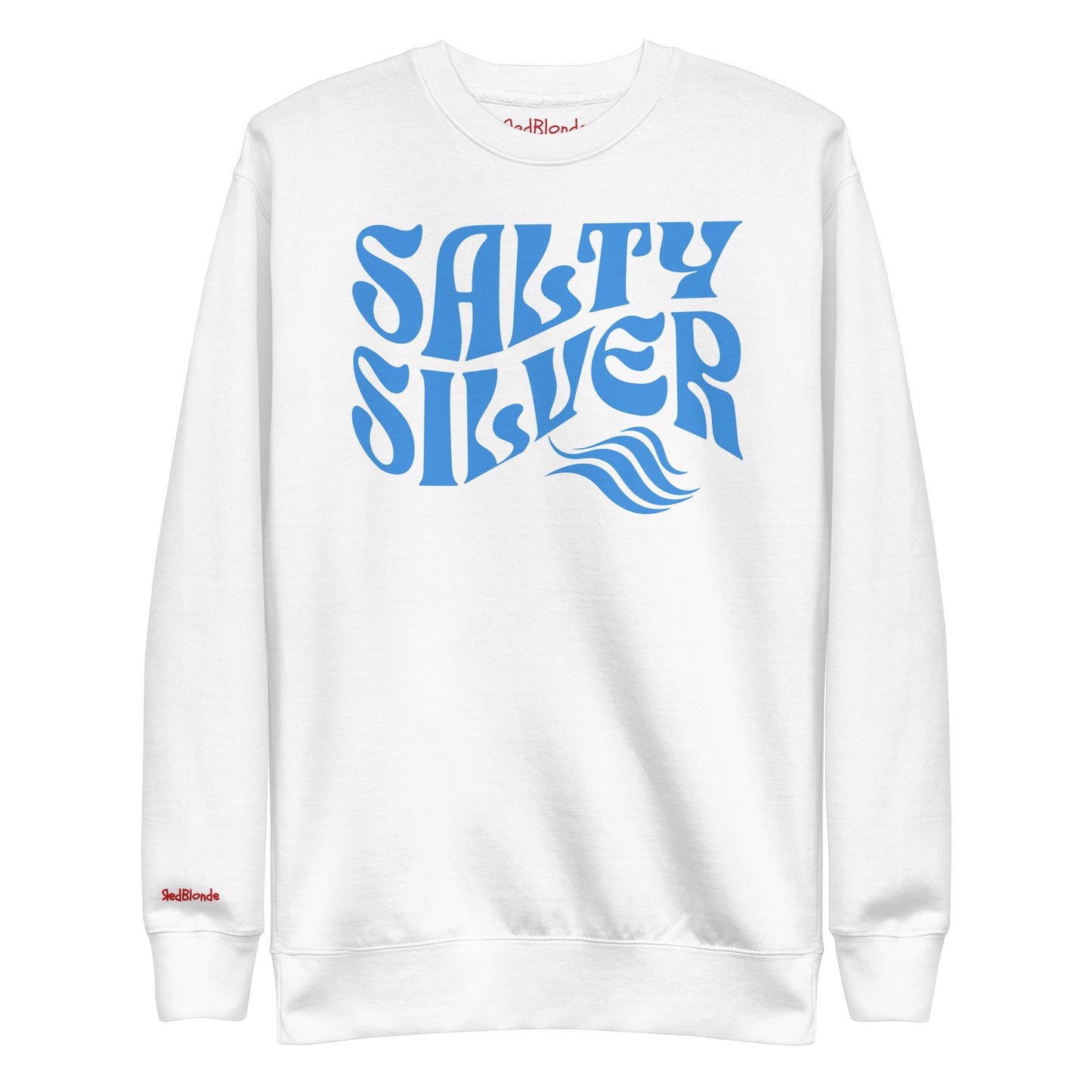 flatlay of Classic relaxed fit unisex sweatshirt in white with 'Salty Silver' play on words slogan in blue retro 70s wavy text. Branded RedBlonde on inside neck and right cuff in red